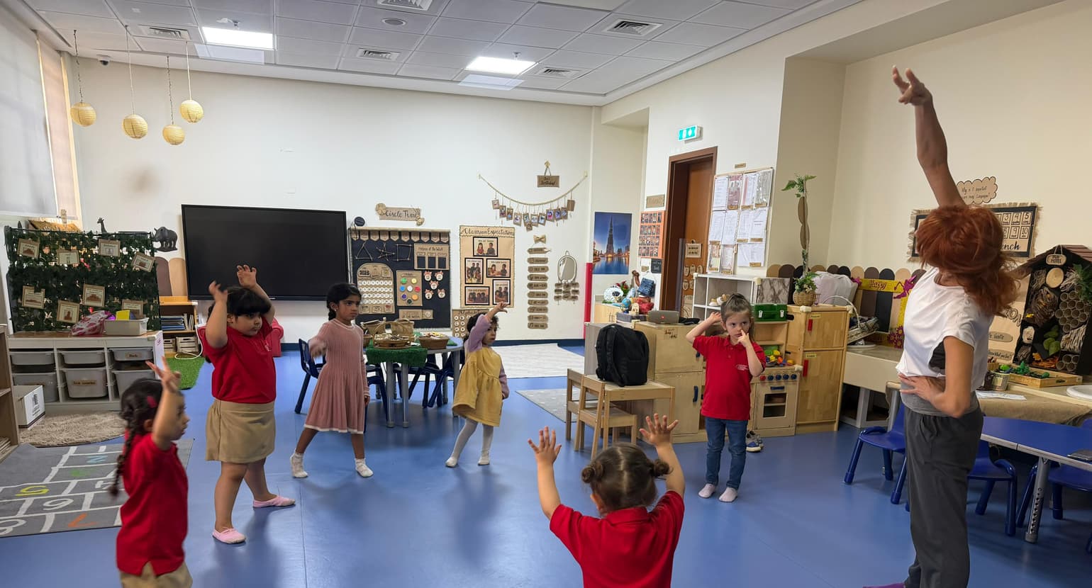 Children and an educator during a movement session in a Little Regent classroom